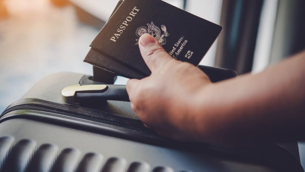 Person holding his passport and luggage